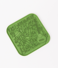 Load image into Gallery viewer, Green silicone lick mat featuring a "Howdy" design with a guitar, horseshoes, and a bottle, ideal for dogs.
