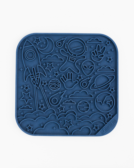 Southlake Paws The Modern Dog Co. Out of this World Space Lick Mat features a blue silicone design with space-themed patterns