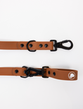 Load image into Gallery viewer, Coco Brown Dog Leash by The Modern Dog Company, featuring a sleek design with black hardware and a logo.

