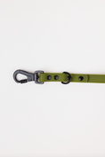 Load image into Gallery viewer, Olive green adjustable dog leash with a black clip and hardware, featuring multiple adjustment points.
