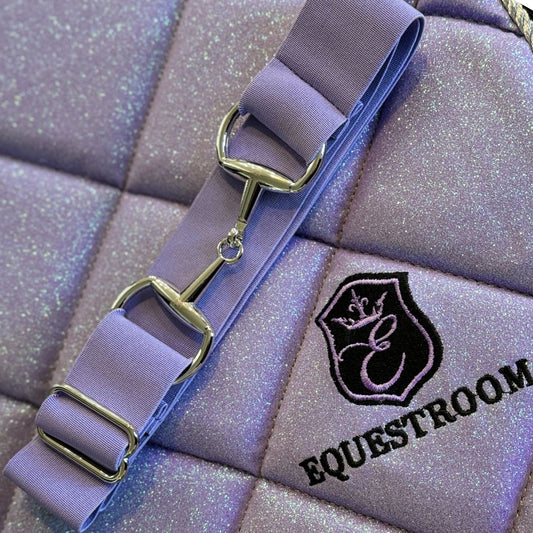 Lavender Elastic Equestrian Belt by Southlake Paws with silver hardware, displayed on a quilted, sparkly background.
