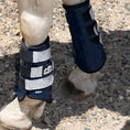 Load image into Gallery viewer, Southlake Paws Patriot American Saddle Pad Set featuring protective horse boots in navy with reflective straps.
