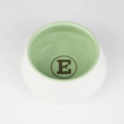 White and green ceramic dog bowl