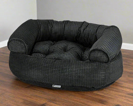 Bowsers Pet Products premium orthopedic donut dog bed in black checkered pattern with supportive bolsters