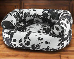 Bowsers Pet Products premium orthopedic donut dog bed in black and white cow print design