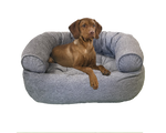 Brown dog resting on a gray premium orthopedic donut dog bed by Bowsers Pet Products