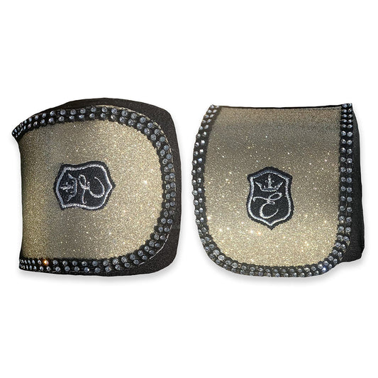Champagne Polo Wraps by Southlake Paws featuring a glittery gold design with black accents and decorative rhinestones.