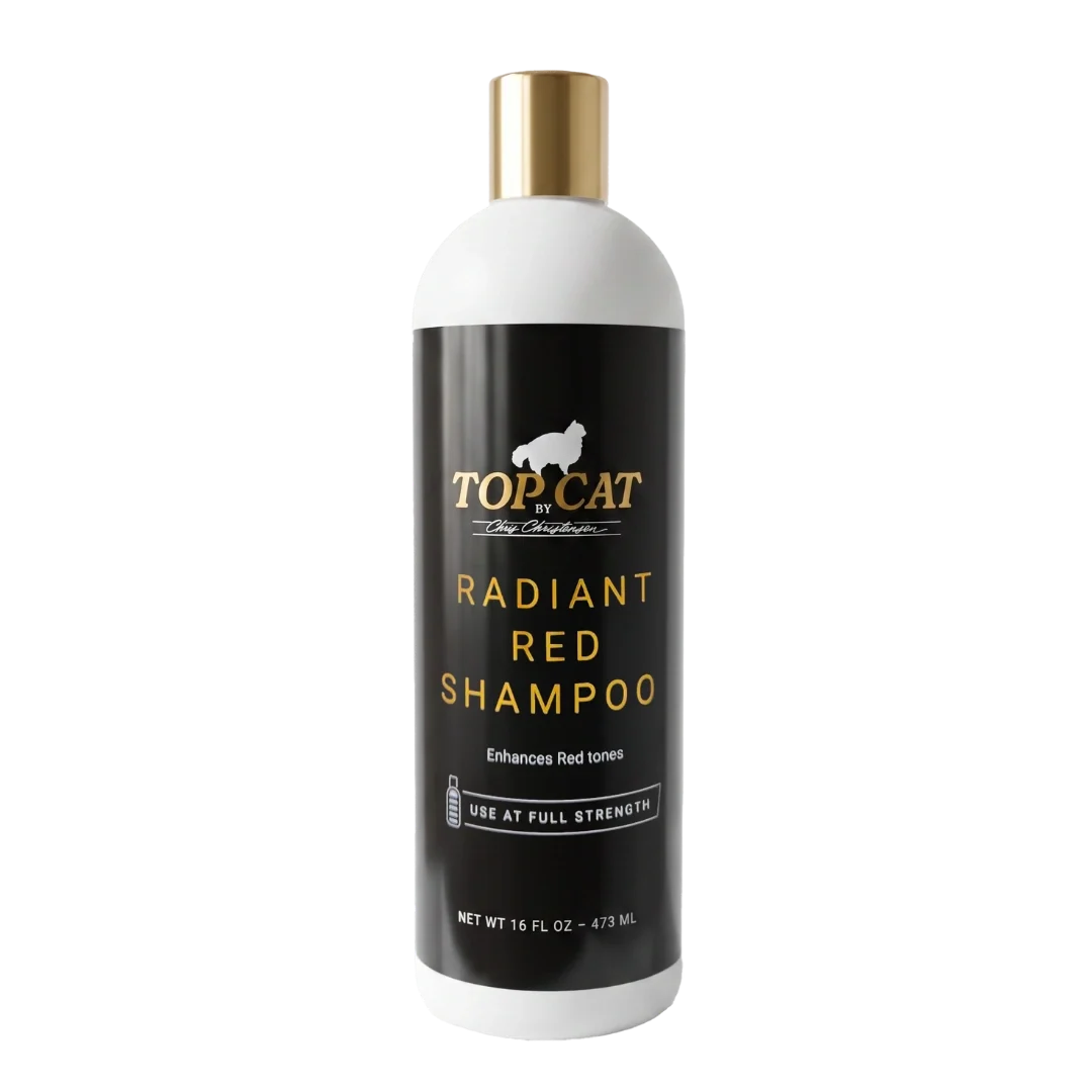 A bottle of TOPCAT Gorgeous Gold Shampoo for dogs, featuring a white bottle with a metallic gold cap and a black label with gold lettering.