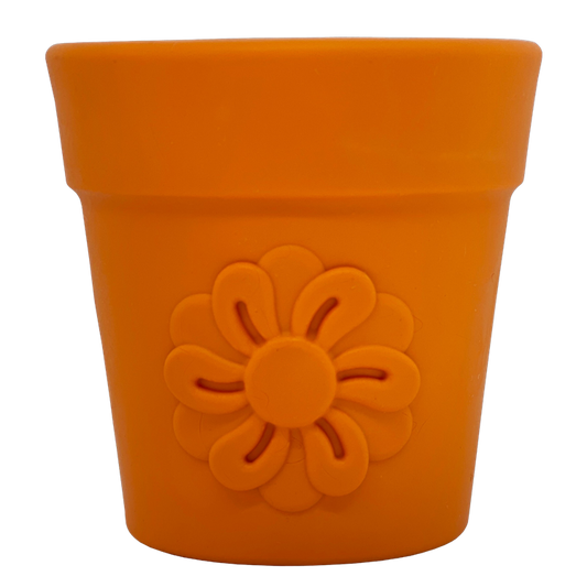 Large orange flower pot-shaped dog treat dispenser with a flower design, made from durable materials for enrichment play.