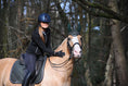 Load image into Gallery viewer, Jade Green Fly Hat by Southlake Paws worn by a rider on a horse in a forest setting.
