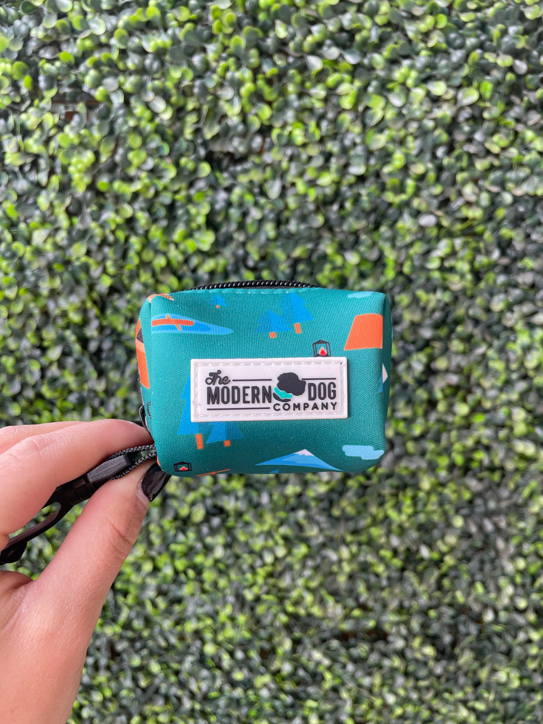 Camping Print Poop Bag Holder by The Modern Dog Company, featuring a colorful design and a convenient clip for attachment.