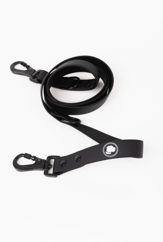 Black dog leash from The Modern Dog Company by Southlake Paws, featuring a sleek design and sturdy clips.