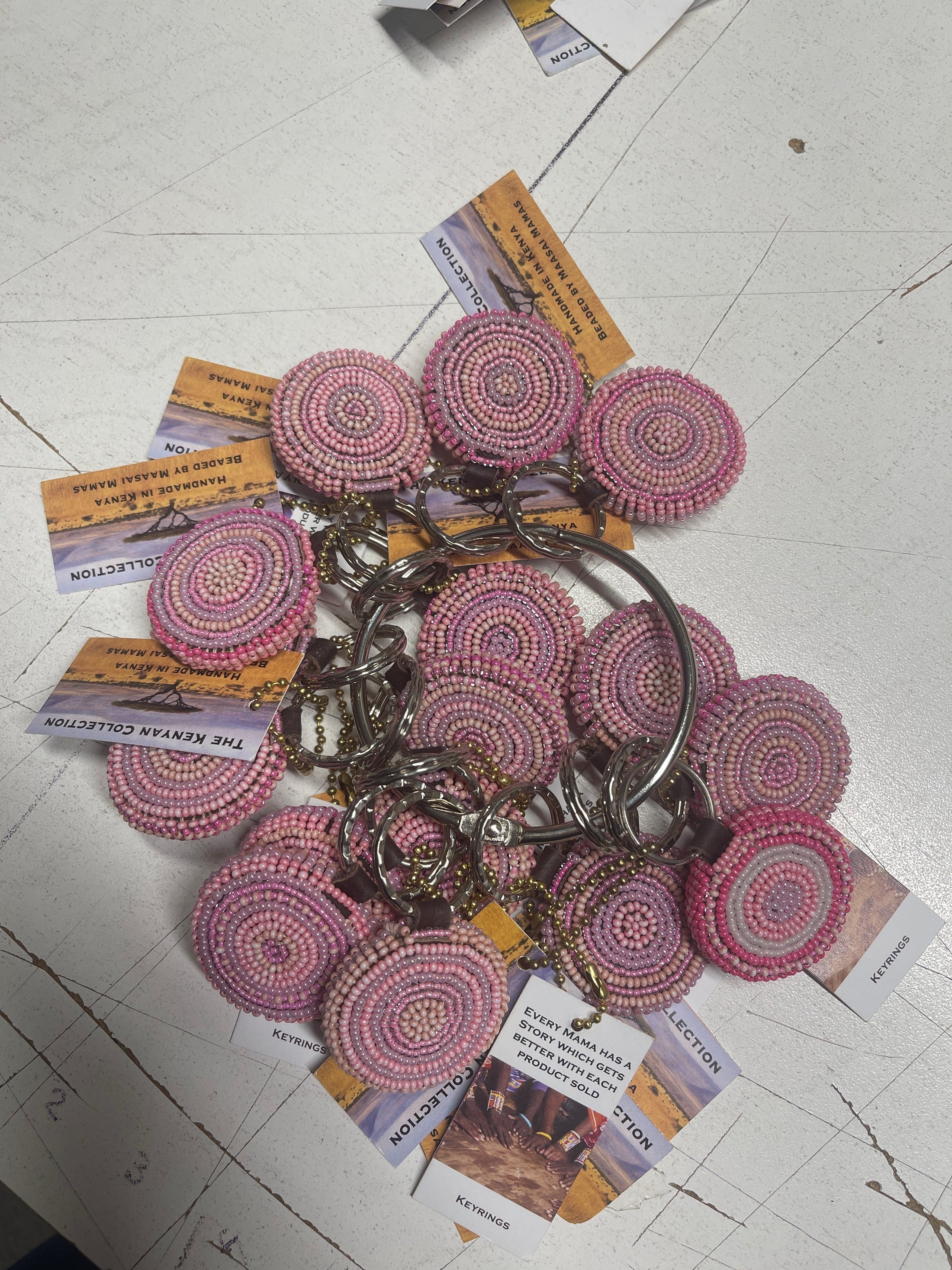 Southlake Paws TKC Beaded Keychain featuring colorful, round beaded designs on key rings, displayed on a table.