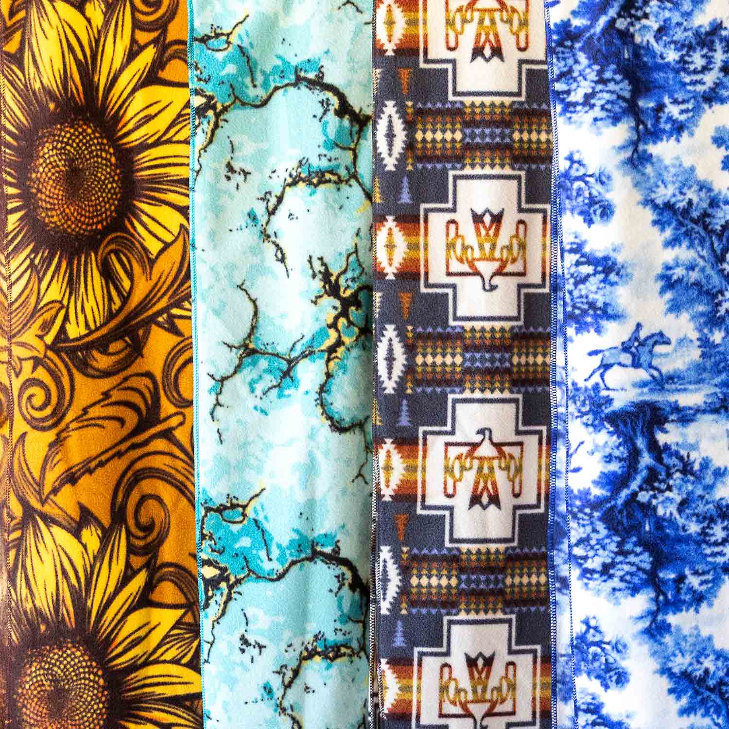 Oversized fleece throw blanket by Southlake Paws featuring vibrant patterns: sunflower, marble, and geometric designs. 60" x 
