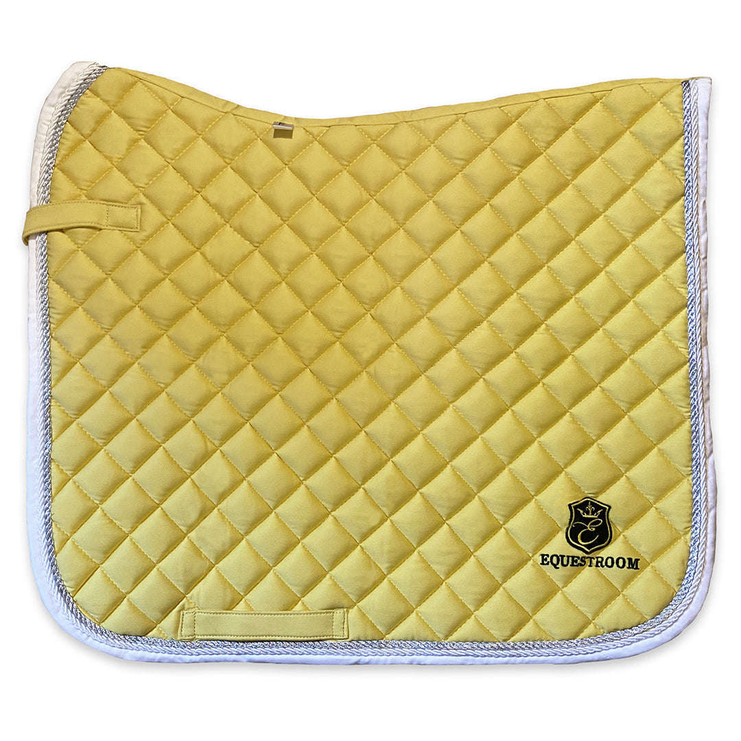 Southlake Paws Mimosa Saddle Pad in yellow with quilted design and white trim, featuring an embroidered logo.