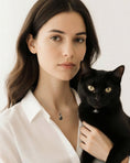 Load image into Gallery viewer, Black Cat Silver Chain Necklace by Southlake Paws worn by a woman holding a black cat, featuring a sleek design.
